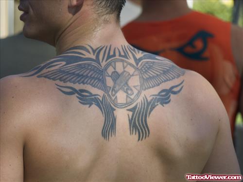 Tribal And Winged Circle Back Tattoo For Men