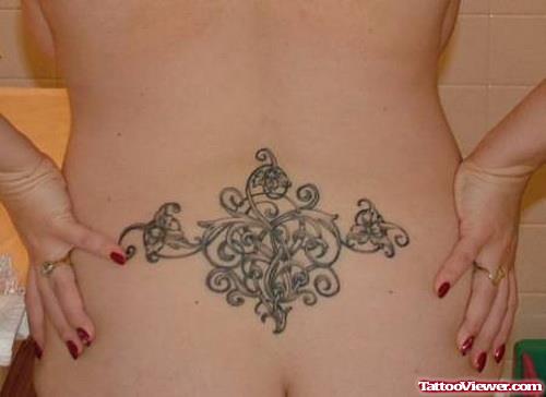 Girl Showing Her Lower Back Tattoo