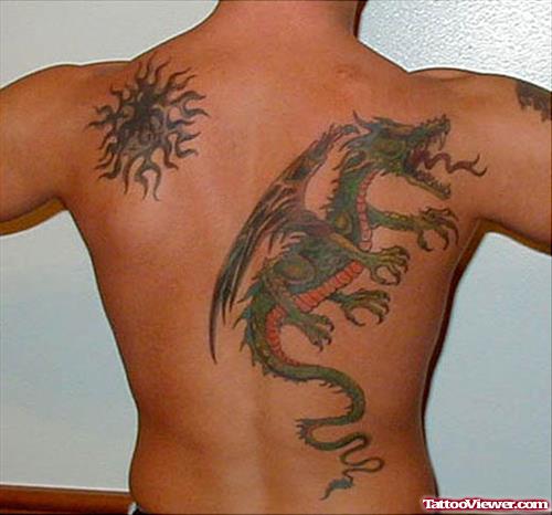 Tribal Sun And Colored Dragon Back Tattoo
