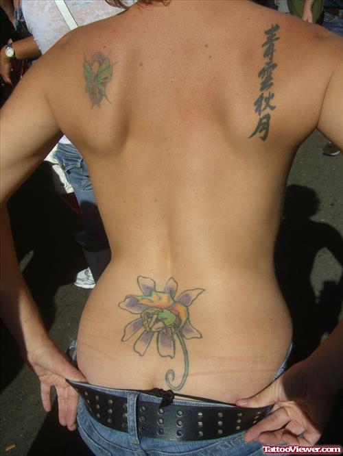 Colored Flower Tattoo On Lowerback