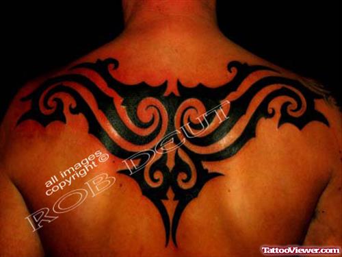 Black Ink Tribal Tattoo On Upperback