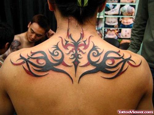 Black and Red Ink Tribal Back Tattoo