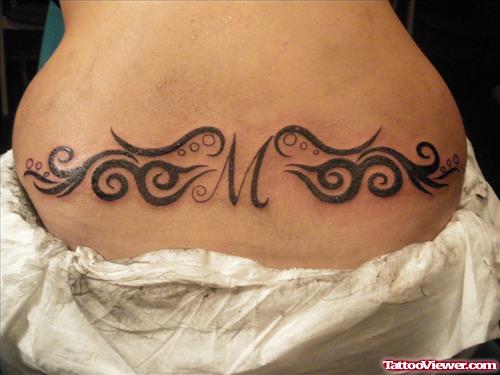 Amazing Black Ink Tribal Lowerback Tattoo