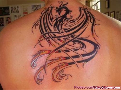 Red And Black Ink Tribal Phoenix Back Tattoo