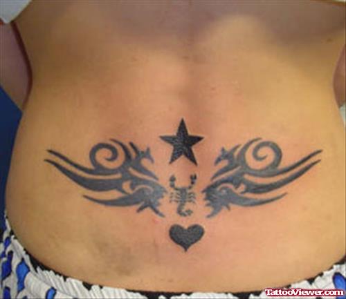 Black Ink Tribal And Star Back Tattoo