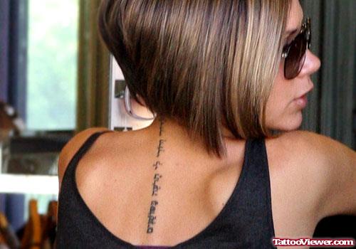 Hebrew Black Ink Back Tattoo For Girls