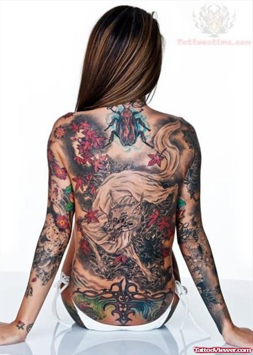 Maple Leaves, Bug And Wolf Tattoo On Back