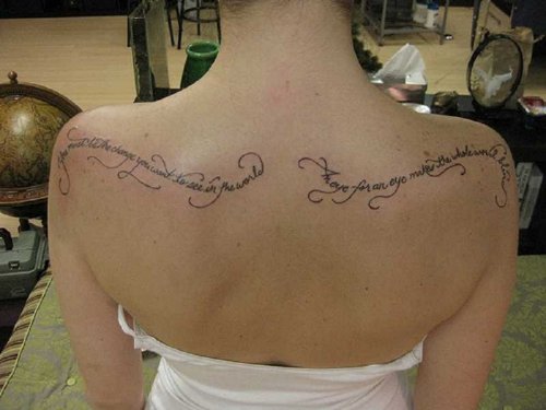 Girl With Lettering Upper Back Tattoo