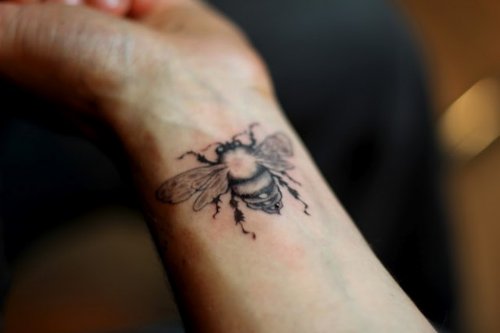 Attractive Left Wrist Bee Tattoo