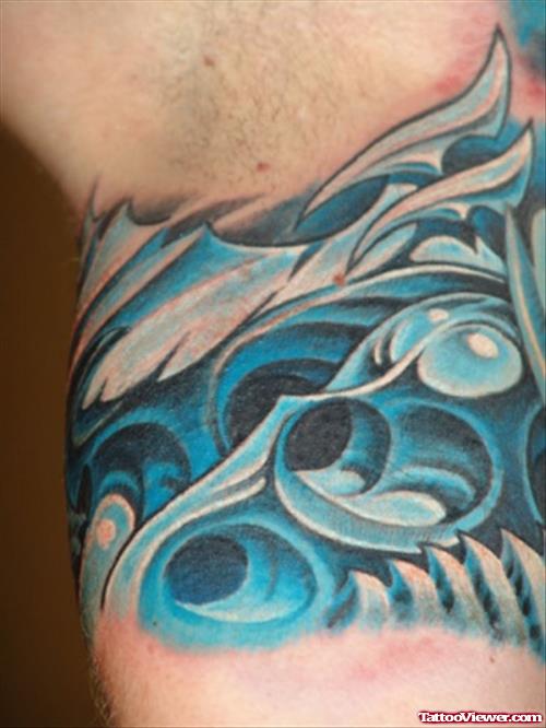 Blue Ink Biomechanical Tattoo