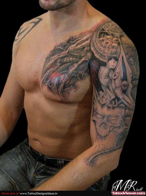 Man With Grey Ink Biomechanical Tattoo On Chest And Left Sleeve