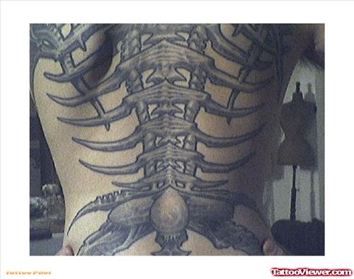 Impressive Grey Ink Biomechanical Tattoo On Back Body