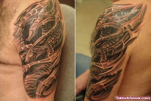 Men With Biomechanical Tattoo On Half Sleeve