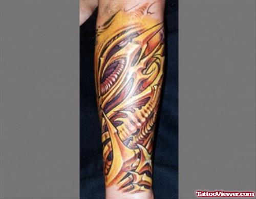 Left Arm Colored Ink Biomechanical Tattoo
