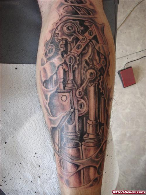 Grey Ink Back Leg Biomechanical Tatto