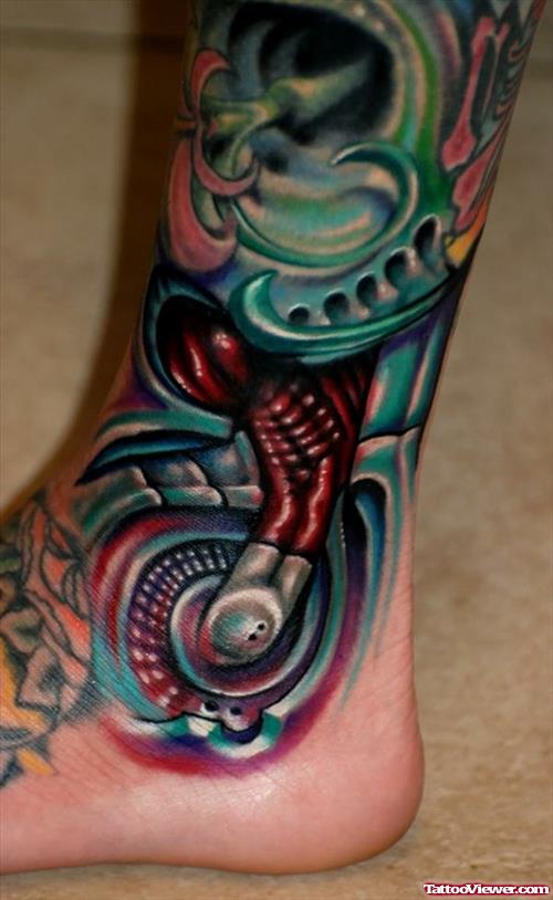 Colored Biomechanical Tattoo On ankle