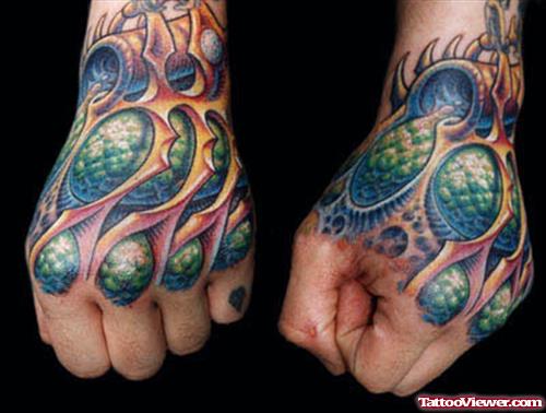 Biomechanical Colored Tattoo On Left Hand