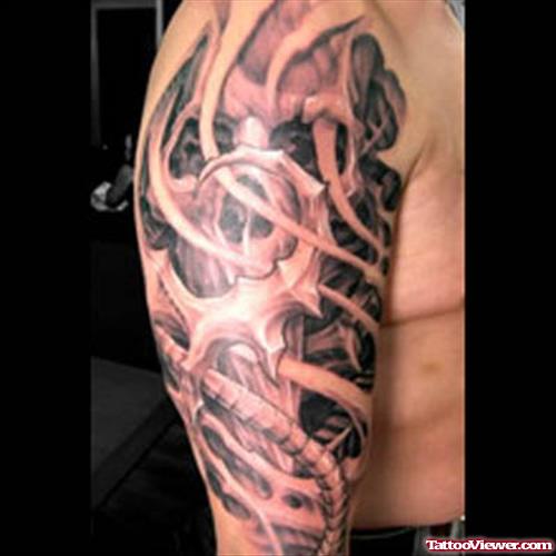 Grey Ink Biomechanical Tattoo On Man Right Sleeve