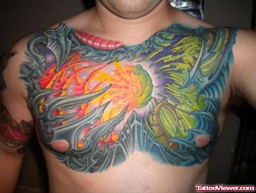 Beautiful Colored Ink Biomechanical Tattoo On Man Chest