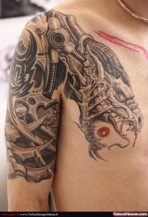 Biomechanical Tattoo On Chest And Right Half Sleeve