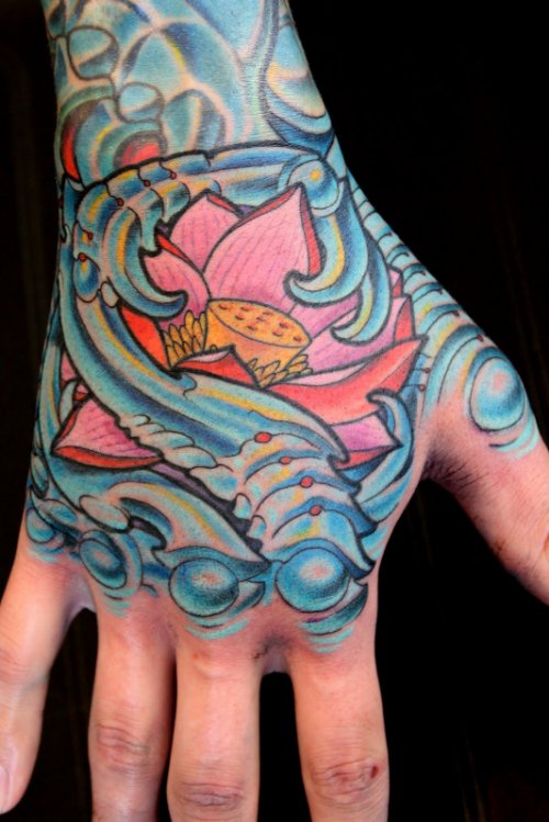 Biomechanical Colored Tattoo On Right Hand