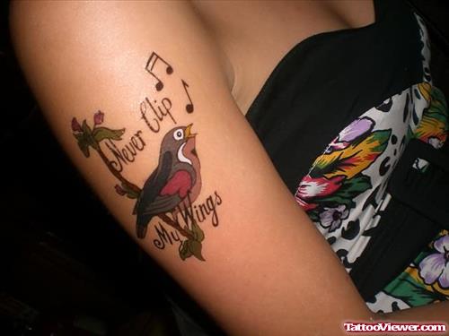 Singing Bird Tattoo On Muscles