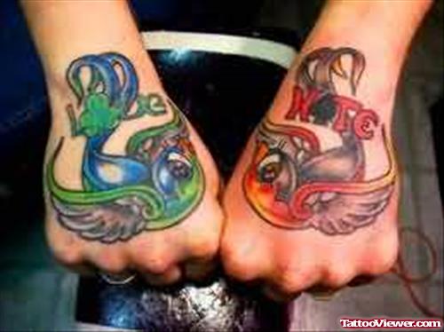 Green & Red Tattoo On Hands