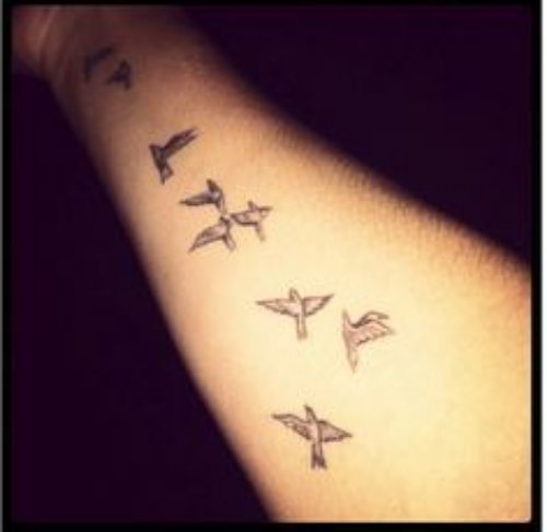 Flying Birds Tattoo On Right Forearm