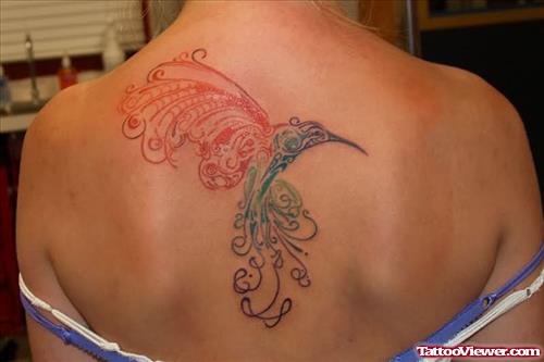 Bird design tattoo on upper back