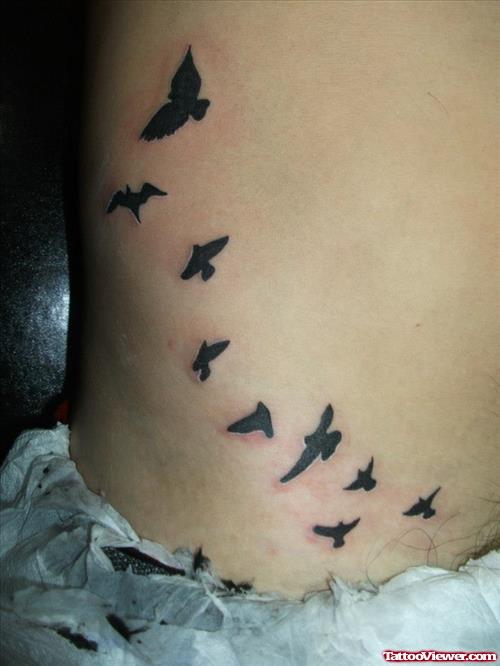 bird fly away tattoo on side