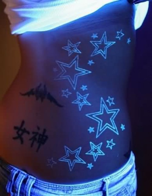 Color Ink Black Light Stars Tattoo On Girl Side Rib