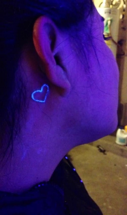 Small Heart Black Light Tattoo Behind Ear