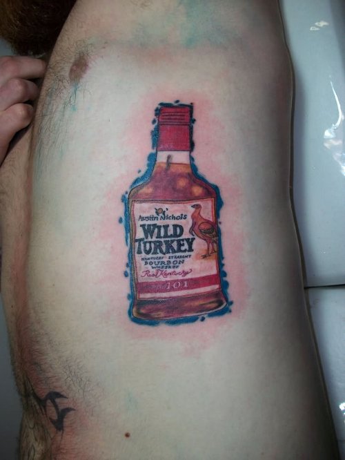 Wild Turkey Bottle Tattoo On Left Side Rib