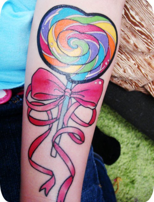 Lollipop and Bow Tattoo On Sleeve