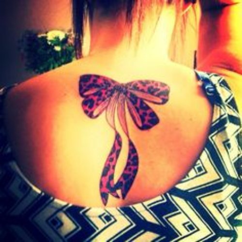 Colored Bow Tattoo On Girl Upperback