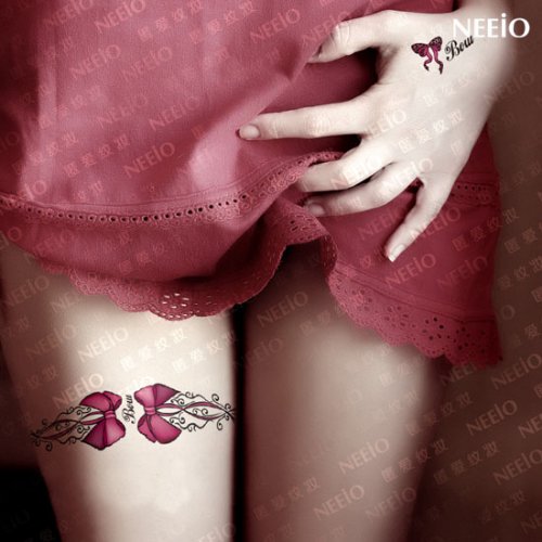 Sweet Pink Bow Tattoo On Girl Thigh