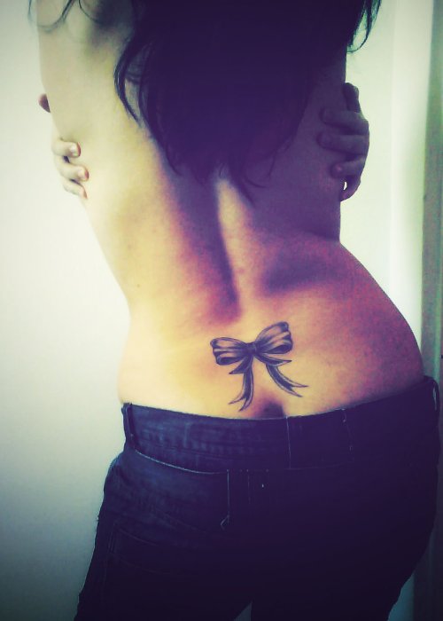 Lowerback Bow Tattoo For Young Girls