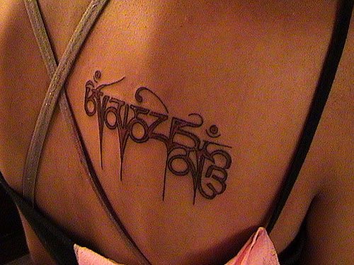 Buddhist Tattoo On Right Back Shoulder For Girls