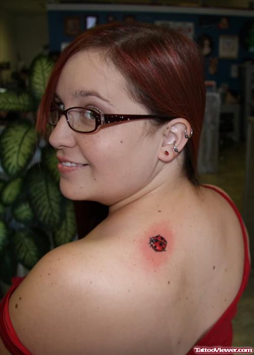 Lady Bug Tattoo On Back