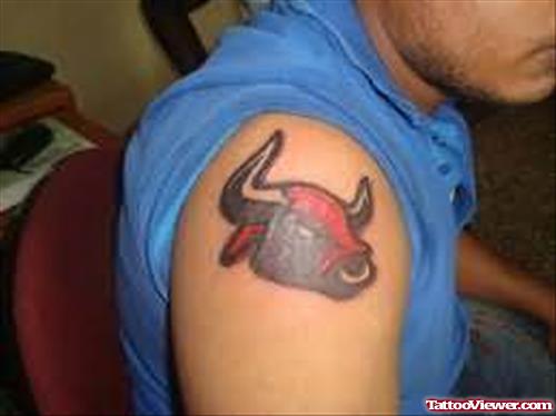Red And Black Bull Tattoo On Shoulder