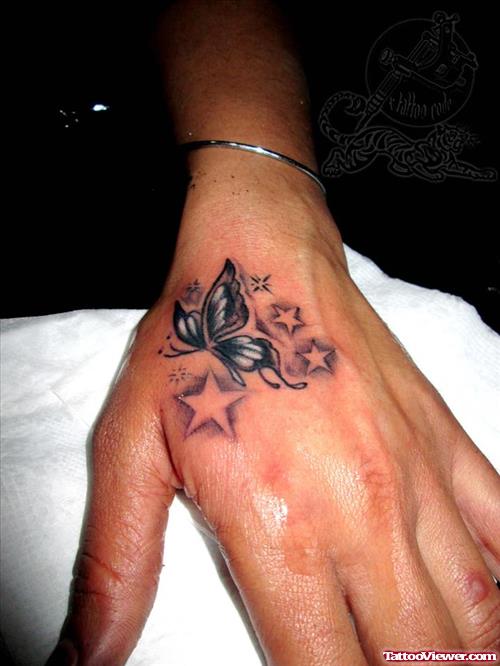 Stars And Butterfly Tattoo On Left Hand