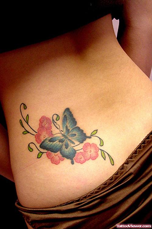 Red Flowers And Blue Ink Butterfly Tattoo On Lowerback