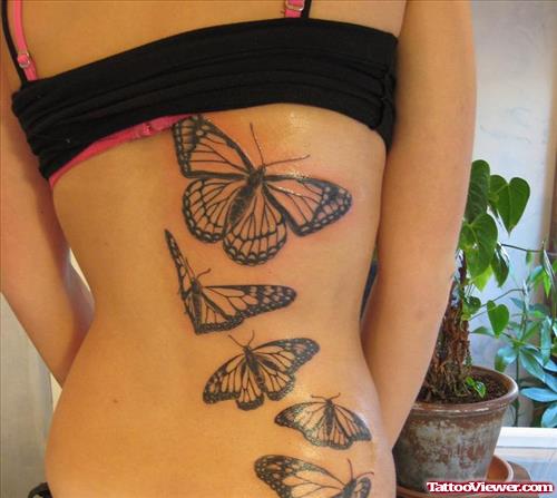 Flying Butterflies Tattoos On Girl Back Body