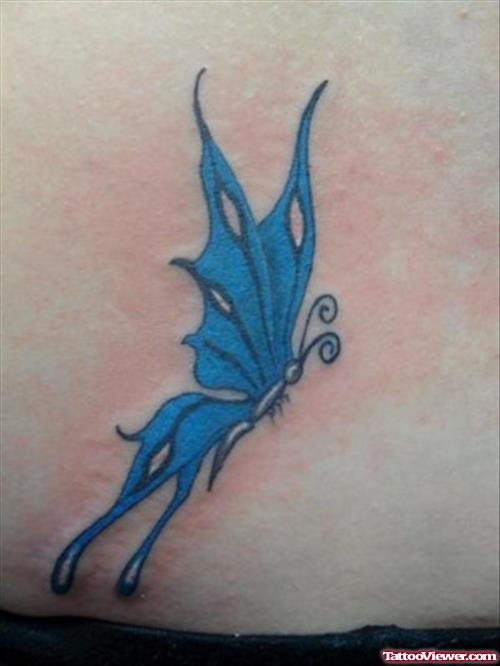 Blue Ink Butterfly Tattoo On Hip