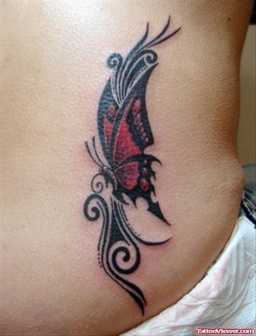 Black Ink Tribal And Red Butterfly Tattoo On Side