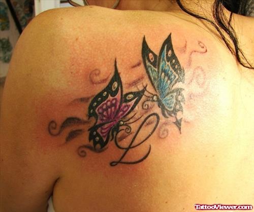 Awesome Colored Butterfly Tattoo On Left Back Shoulder