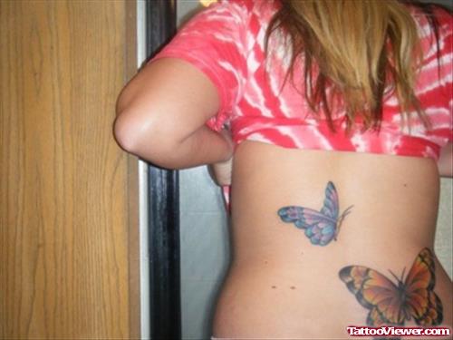 Girl With Beautiful Colored Butterfly Tattoo On Back