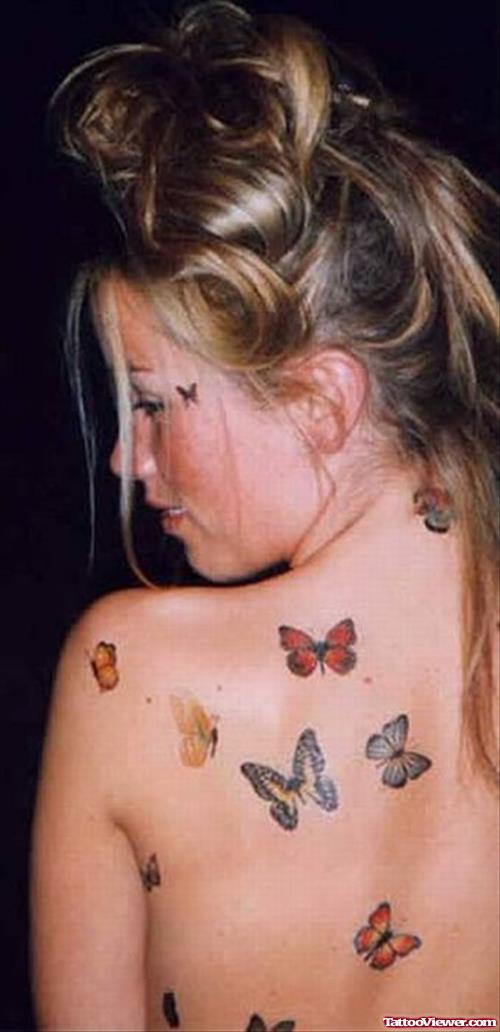 Colored Butterflies Tattoos On Girl Back Body