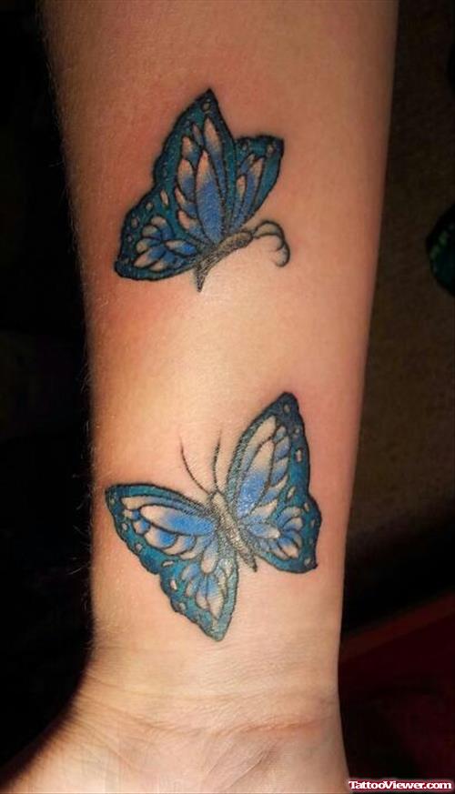 Blue Ink Butterfly Tattoo On Right Arm