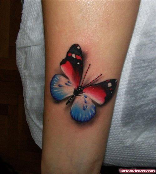 Black,Red And Blue Colored Butterfly Tattoo On Arm